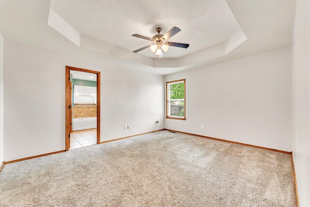 1240 Tyler Ln, Nixa, MO 65714 - unfurnished room featuring carpet flooring, a raised ceiling, baseboards, and ceiling fan
