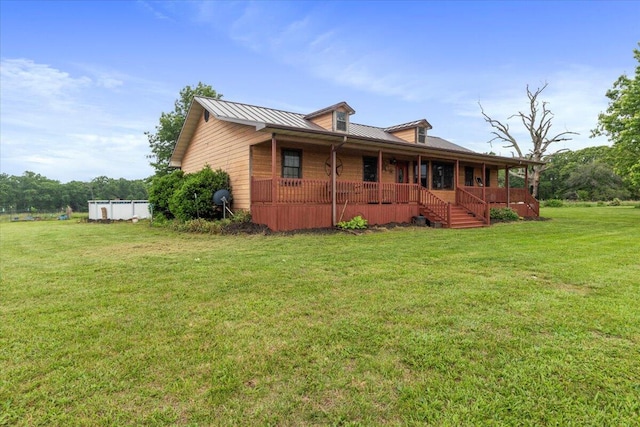 6203 County Road 1750, West Plains, MO 65775 - view of home's exterior with covered porch, a yard, metal roof, and a standing seam roof