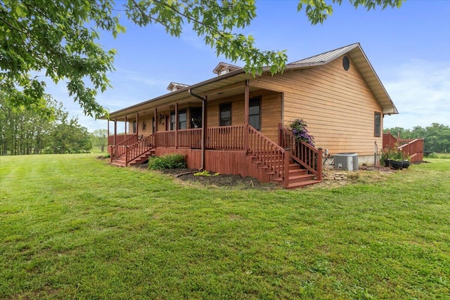 6203 County Road 1750, West Plains, MO 65775 - view of front of property with a porch, stairway, central AC unit, and a front lawn