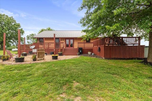 6203 County Road 1750, West Plains, MO 65775 - rear view of house featuring a yard, a deck, french doors, a standing seam roof, and metal roof