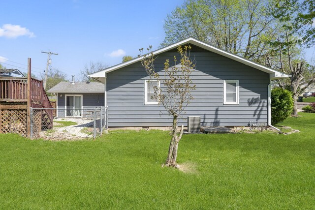 rear view of house featuring central air condition unit, crawl space, and a wooden deck