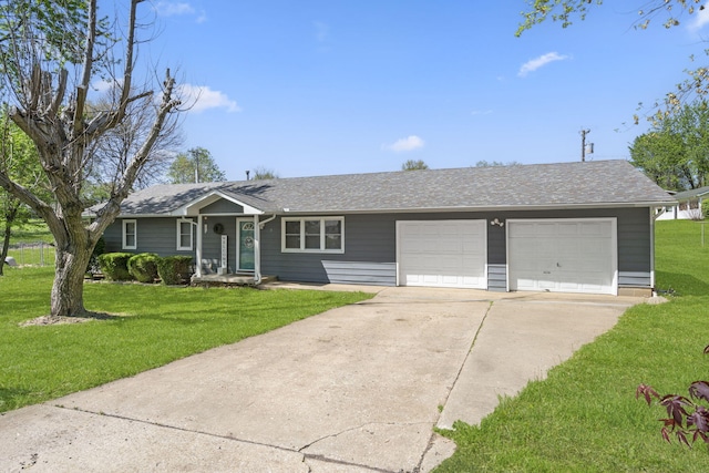 ranch-style house with driveway, a garage, a front yard, and roof with shingles
