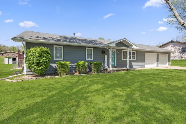 ranch-style house with an attached garage, a front yard, and a shingled roof