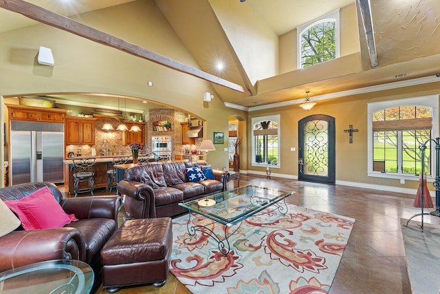 315 Buckskin Rdg, Pineville, MO 64856 - living room with arched walkways, healthy amount of natural light, high vaulted ceiling, baseboards, and recessed lighting
