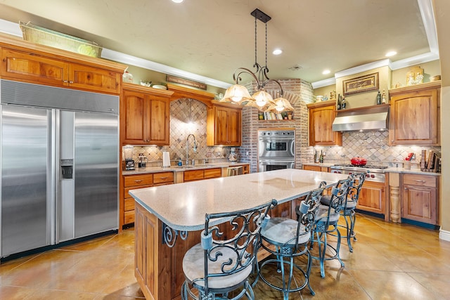 315 Buckskin Rdg, Pineville, MO 64856 - kitchen with appliances with stainless steel finishes, extractor fan, a kitchen island, light tile patterned floors, and crown molding
