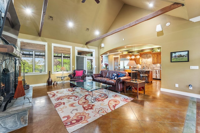 315 Buckskin Rdg, Pineville, MO 64856 - tiled living area featuring arched walkways, high vaulted ceiling, baseboards, a chandelier, and a ceiling fan