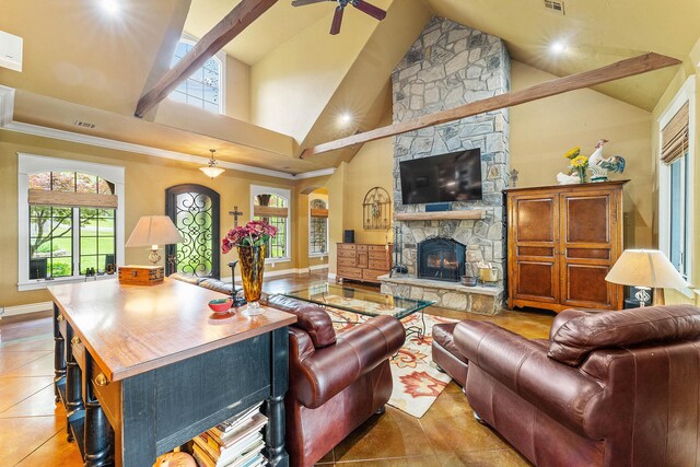 315 Buckskin Rdg, Pineville, MO 64856 - living area with a ceiling fan, high vaulted ceiling, a stone fireplace, light tile patterned floors, and baseboards
