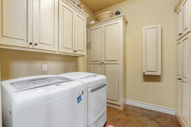 315 Buckskin Rdg, Pineville, MO 64856 - laundry area featuring separate washer and dryer, baseboards, cabinet space, and dark tile patterned floors