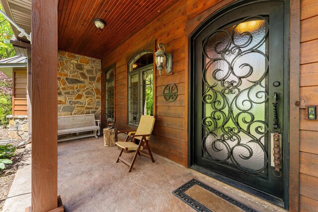 315 Buckskin Rdg, Pineville, MO 64856 - doorway to property featuring covered porch