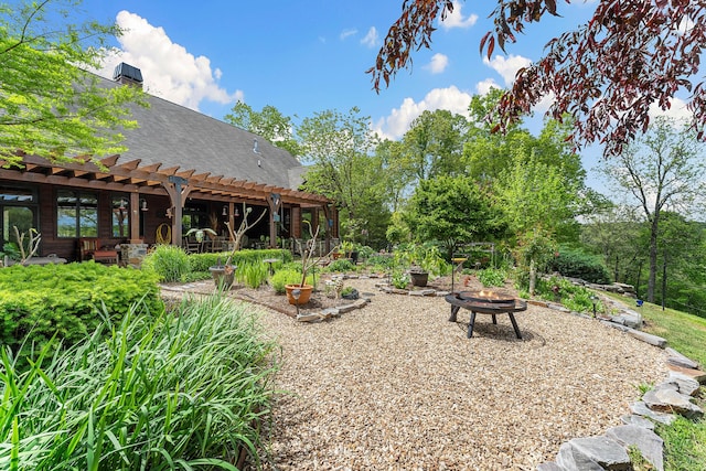 315 Buckskin Rdg, Pineville, MO 64856 - view of yard featuring a fire pit, a pergola, and a patio area