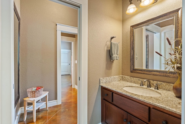 315 Buckskin Rdg, Pineville, MO 64856 - bathroom with a textured wall, tile patterned flooring, baseboards, and vanity