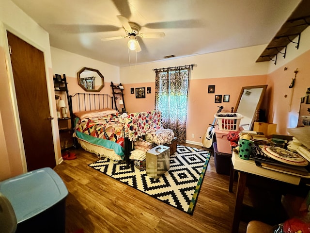 bedroom with wood finished floors and ceiling fan