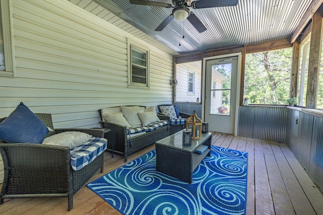 sunroom with a ceiling fan and outdoor lounge area