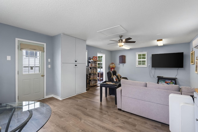 26478 Shadow Rd, Pittsburg, MO 65724 - living room with ceiling fan, light wood finished floors, and a textured ceiling