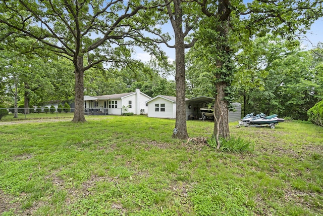 26478 Shadow Rd, Pittsburg, MO 65724 - view of yard with a carport and view of wooded area