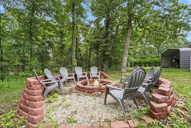 26478 Shadow Rd, Pittsburg, MO 65724 - view of patio featuring a fire pit