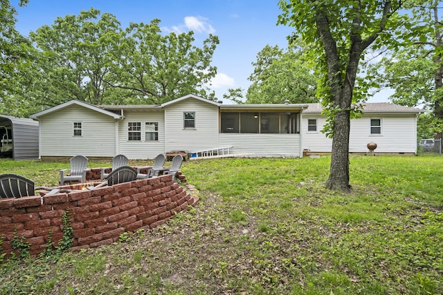 26478 Shadow Rd, Pittsburg, MO 65724 - back of house featuring a sunroom, a fire pit, a yard, and crawl space