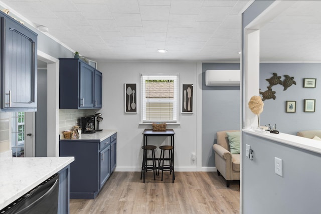 26478 Shadow Rd, Pittsburg, MO 65724 - kitchen with an AC wall unit, blue cabinets, dishwashing machine, light wood-style floors, and backsplash