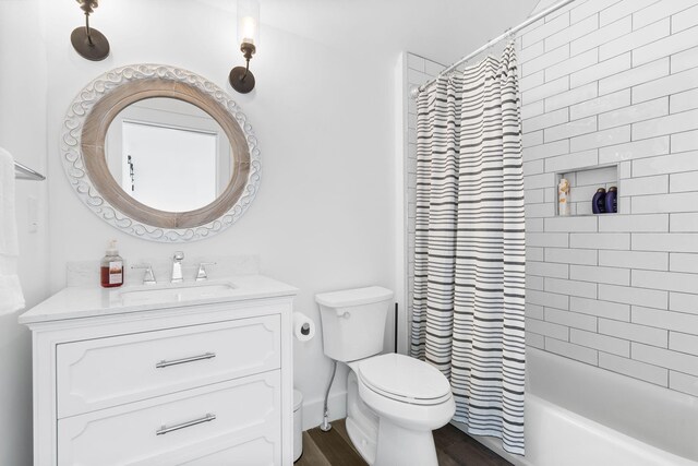 452 Rest Haven Ln, Blue Eye, MO 65611 - bathroom with toilet, vanity, wood finished floors, and shower / bathtub combination with curtain
