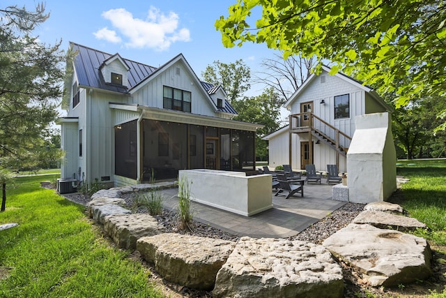 452 Rest Haven Ln, Blue Eye, MO 65611 - back of house with a sunroom, a patio area, central air condition unit, metal roof, and board and batten siding