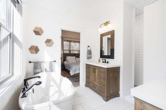 452 Rest Haven Ln, Blue Eye, MO 65611 - ensuite bathroom with a freestanding bath, tile patterned floors, and vanity