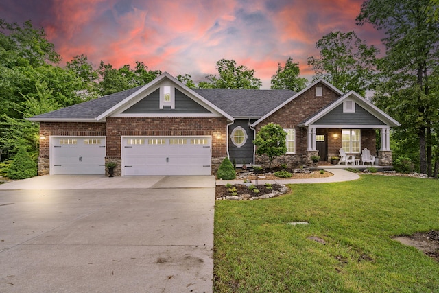 103 Dogwood Ct, Saddlebrooke, MO 65630 - craftsman-style house with a lawn, a garage, a porch, concrete driveway, and brick siding