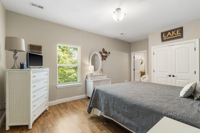 103 Dogwood Ct, Saddlebrooke, MO 65630 - bedroom with light wood-style flooring, baseboards, and a closet