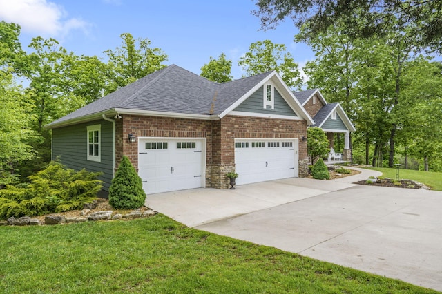 103 Dogwood Ct, Saddlebrooke, MO 65630 - view of front of property featuring concrete driveway, roof with shingles, a front lawn, and a garage
