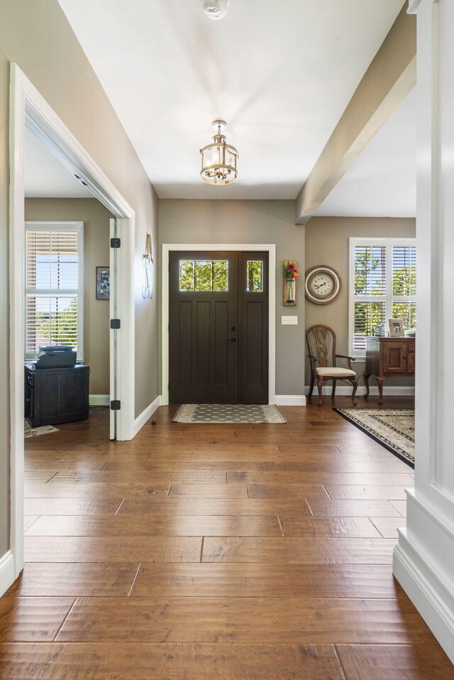 103 Dogwood Ct, Saddlebrooke, MO 65630 - entryway featuring a chandelier, baseboards, and hardwood / wood-style flooring