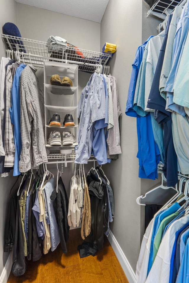 103 Dogwood Ct, Saddlebrooke, MO 65630 - walk in closet featuring wood finished floors