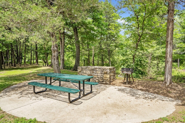 103 Dogwood Ct, Saddlebrooke, MO 65630 - view of community featuring a patio and outdoor dining area