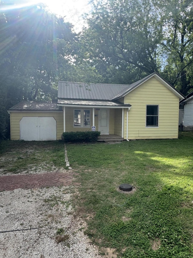 2007 N Travis Ave, Springfield, MO 65803 - ranch-style home with a porch, a front yard, and metal roof