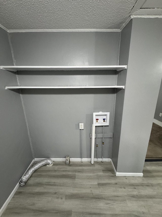 2007 N Travis Ave, Springfield, MO 65803 - laundry area with washer hookup, wood finished floors, a textured ceiling, baseboards, and ornamental molding