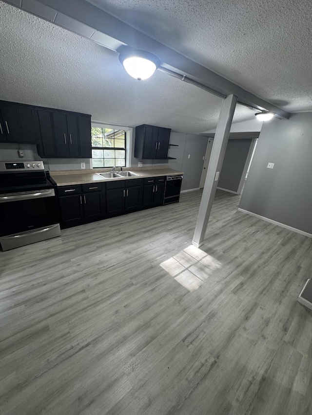 2007 N Travis Ave, Springfield, MO 65803 - kitchen featuring stainless steel electric range, dark cabinets, a sink, a textured ceiling, and light wood-style floors