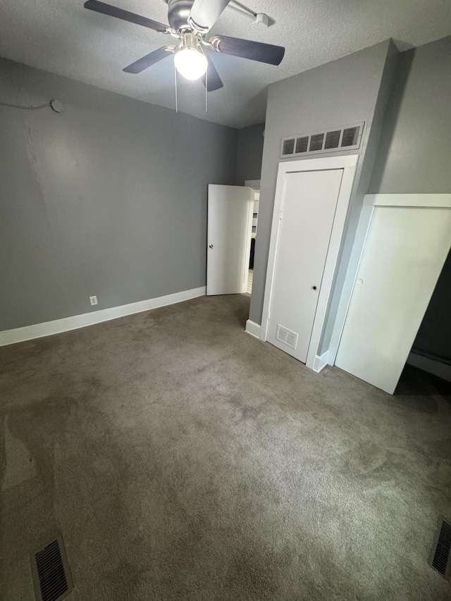 2007 N Travis Ave, Springfield, MO 65803 - unfurnished bedroom with carpet floors, a textured ceiling, ceiling fan, and baseboards