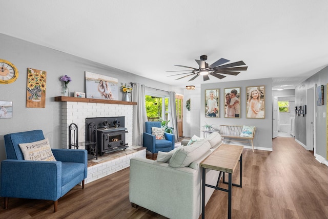 3662 N Farm Rd Unit 127, Springfield, MO 65803 - living area featuring wood finished floors, ceiling fan, and baseboards