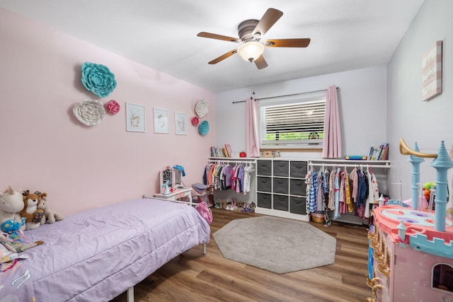 3662 N Farm Rd Unit 127, Springfield, MO 65803 - bedroom featuring wood finished floors and a ceiling fan