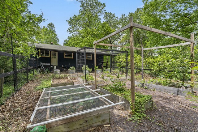 3662 N Farm Rd Unit 127, Springfield, MO 65803 - back of property featuring a garden and fence