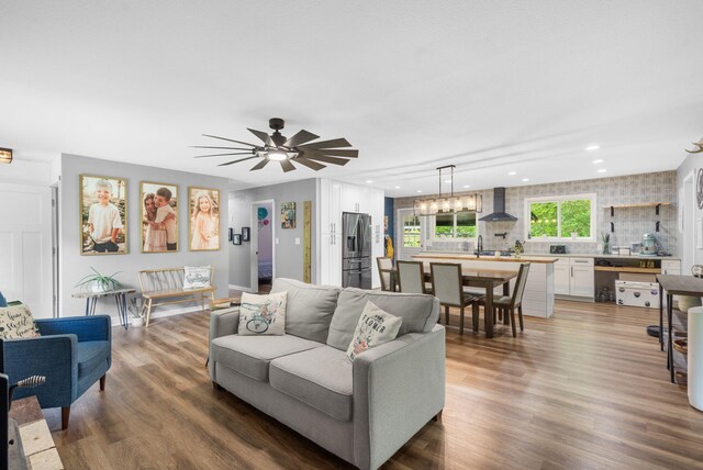 3662 N Farm Rd Unit 127, Springfield, MO 65803 - living room with wood finished floors, ceiling fan, recessed lighting, and a chandelier