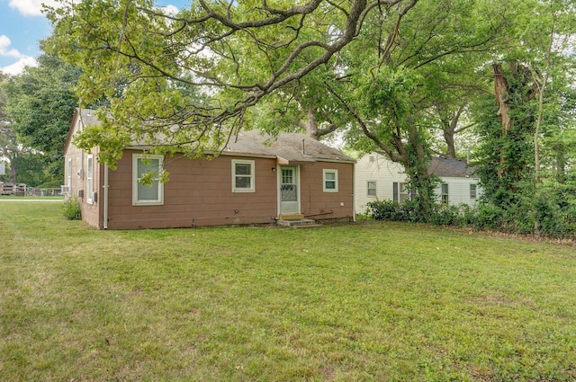 2708 N Fremont Ave, Springfield, MO 65803 - back of property featuring a yard and entry steps