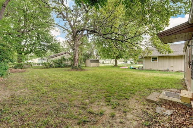 2708 N Fremont Ave, Springfield, MO 65803 - view of grassy yard with a storage unit and an outdoor structure