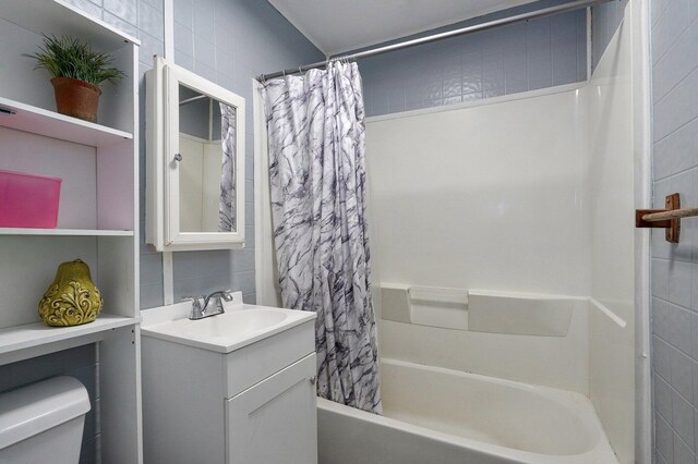 2708 N Fremont Ave, Springfield, MO 65803 - bathroom featuring toilet, shower / bath combo, and vanity