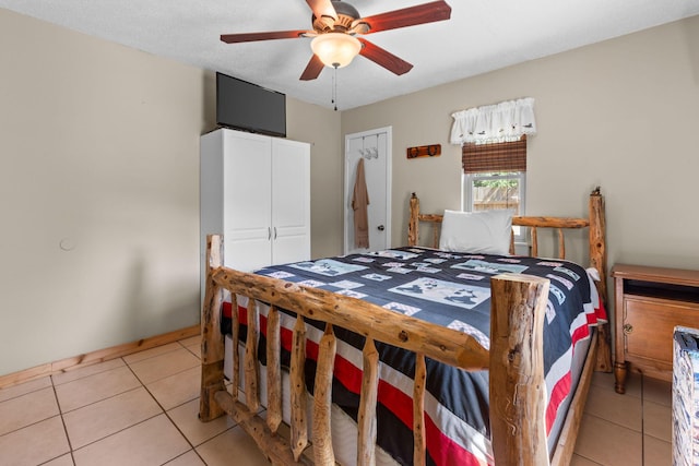 229 Grand Slam Ave, Cape Fair, MO 65624 - bedroom featuring light tile patterned floors, a closet, and ceiling fan