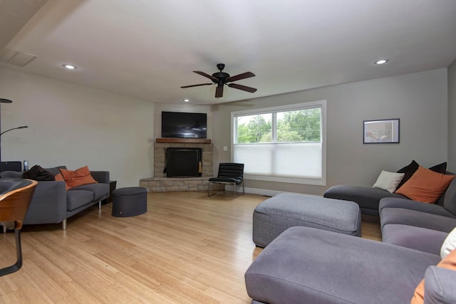 700 E Delmar St, Springfield, MO 65807 - living area featuring a stone fireplace, light wood-style flooring, ceiling fan, recessed lighting, and baseboards