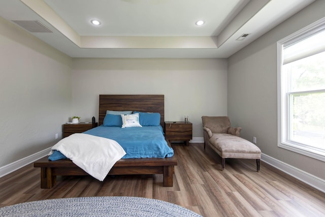 700 E Delmar St, Springfield, MO 65807 - bedroom featuring wood finished floors, a raised ceiling, baseboards, and recessed lighting