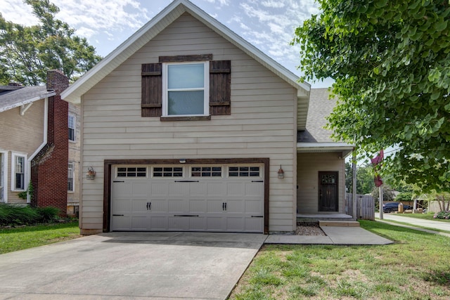 700 E Delmar St, Springfield, MO 65807 - traditional-style house featuring an attached garage, driveway, and a front lawn