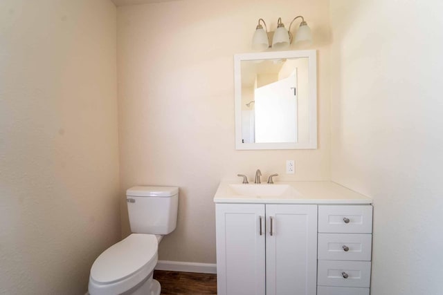 bathroom featuring toilet and vanity
