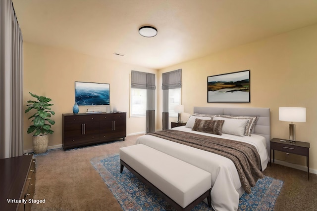 bedroom with carpet floors and baseboards