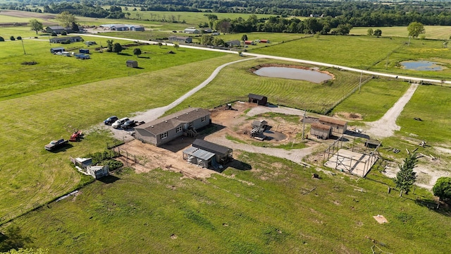aerial view of property and surrounding area featuring rural landscape