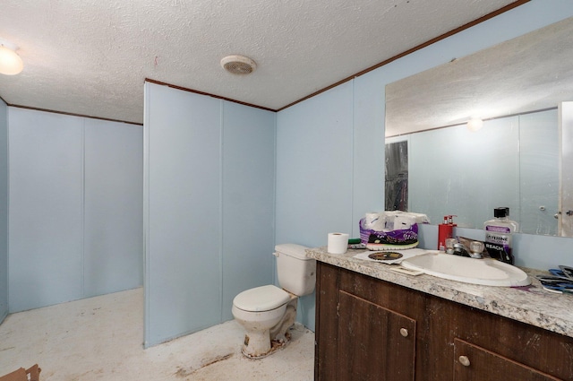 bathroom featuring a textured ceiling, vanity, and toilet